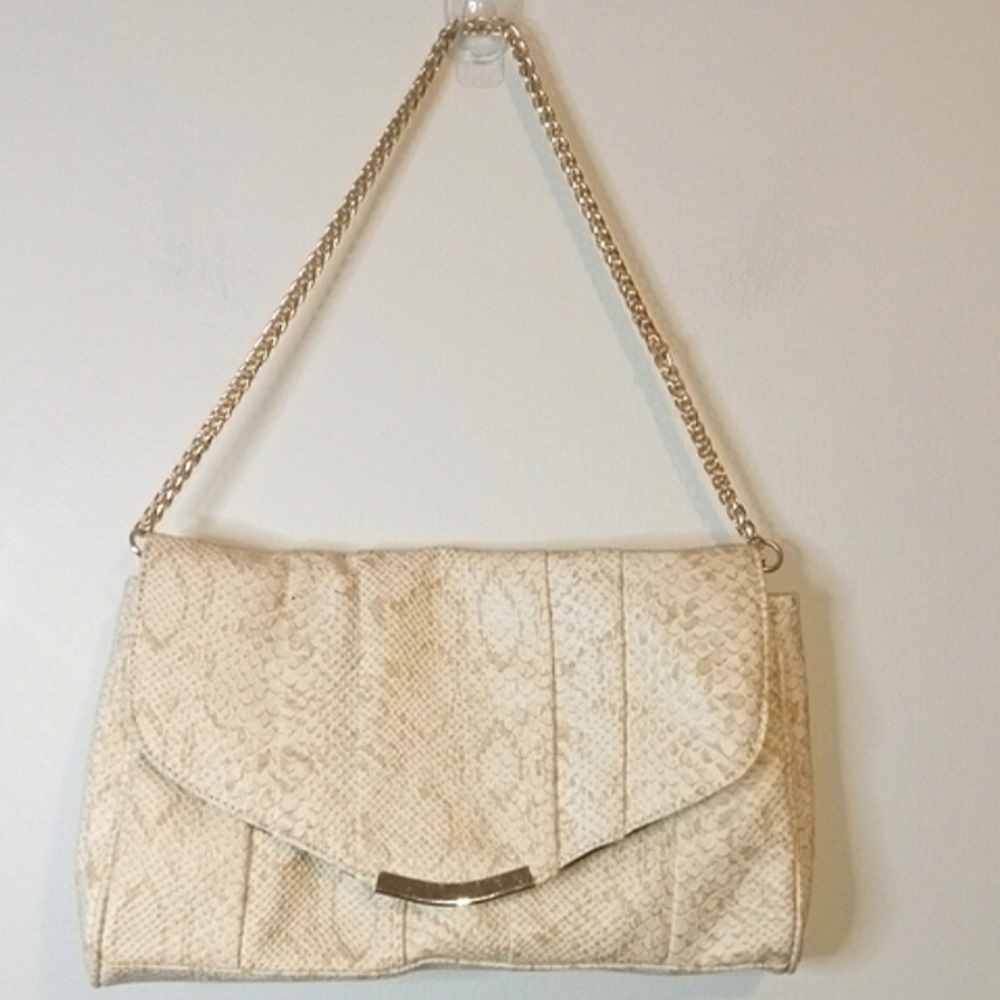 NWOT charming charming faux Print snake bag with good hardware.